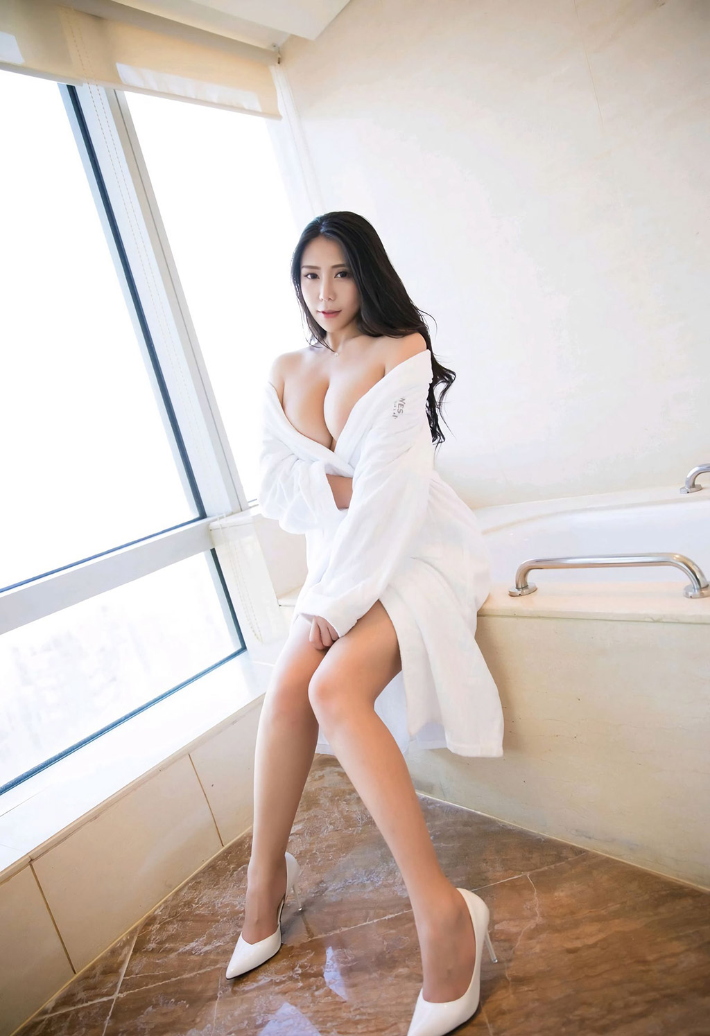 Anker's hollowed-out lingerie and the perfect huge breasts under the bathrobe.
